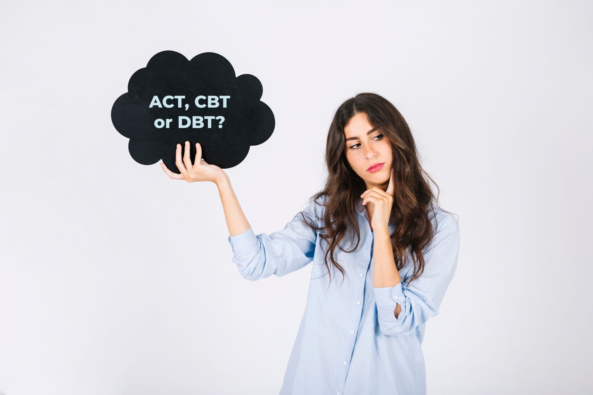A person thinking about the types of mental health counselling in Singapore. The person is holding one poster of a thought bubble.
