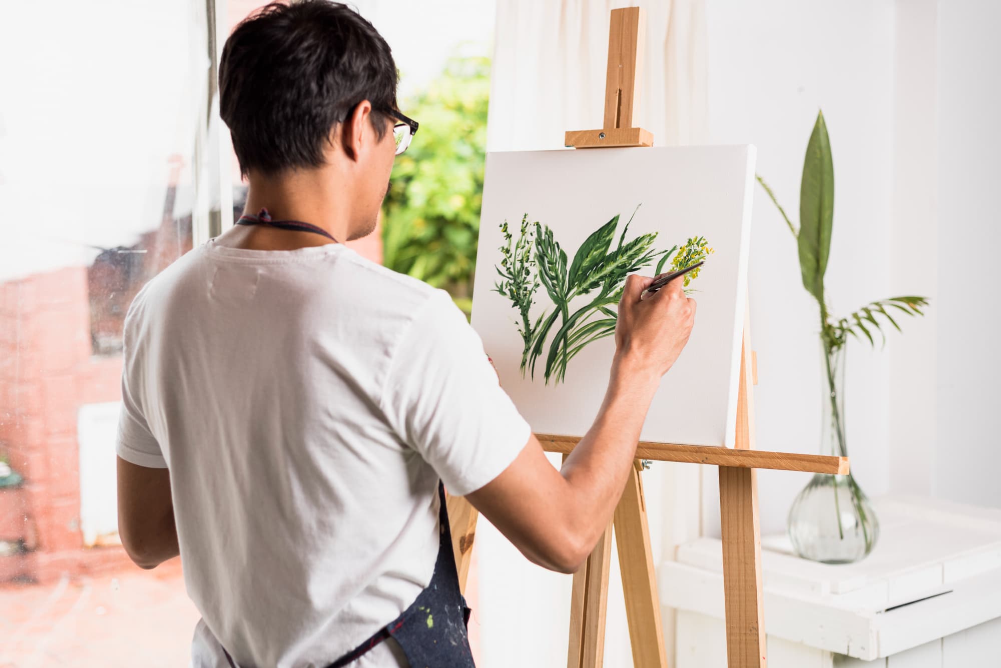 A person reconnecting with an old hobby – painting.