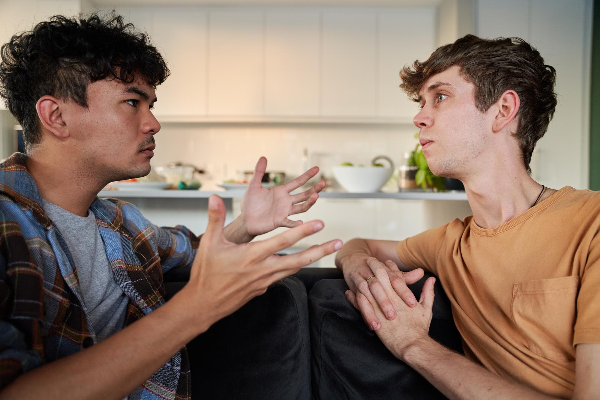 A young couple stuck in an argument and considering going to couples counselling in Australia.