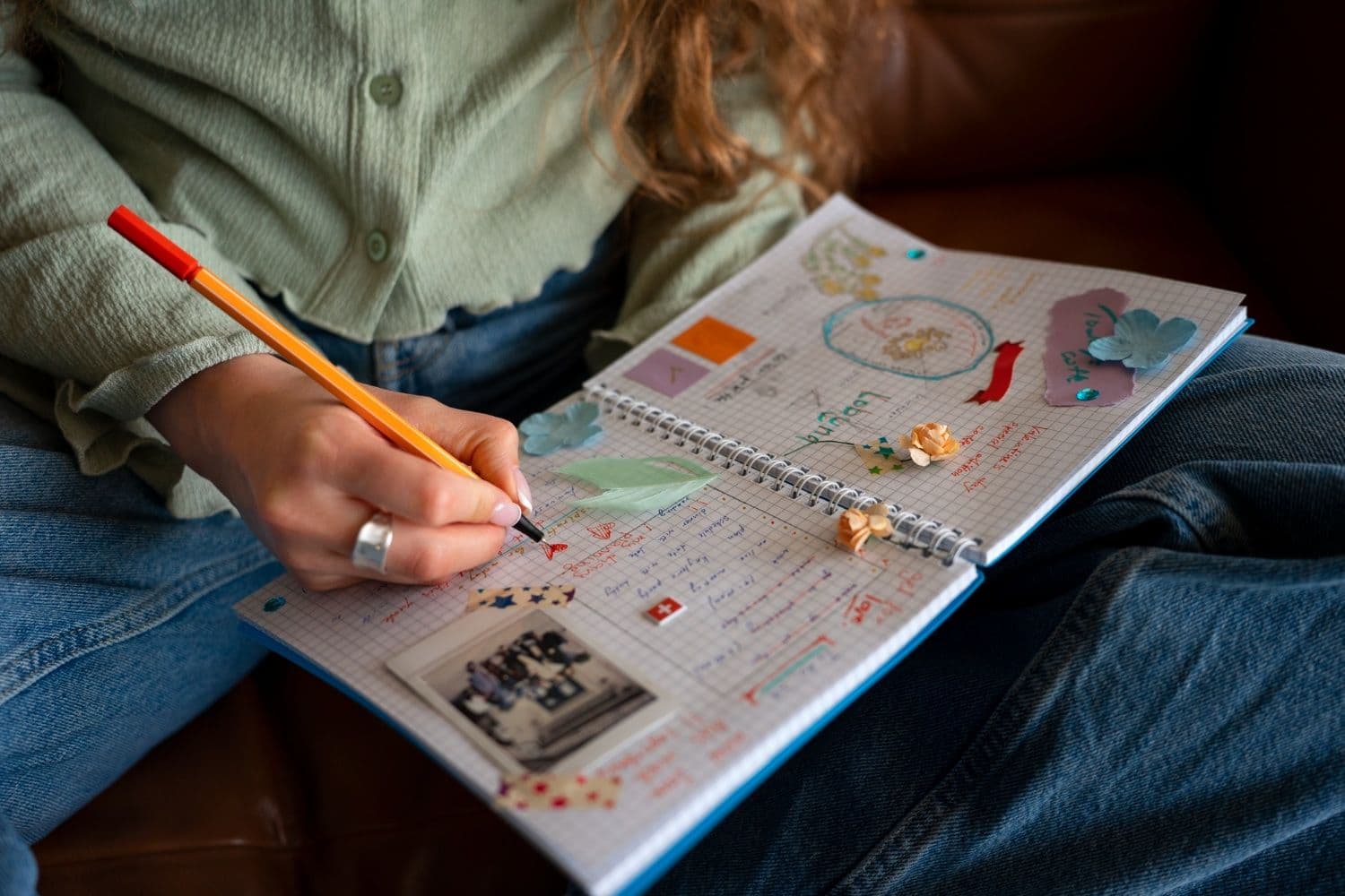 Person tracking their therapy goals before seeking therapy in Singapore.