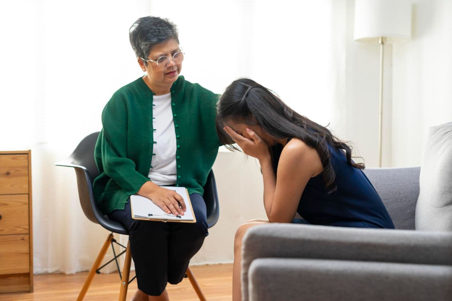A teenager talking to a counsellor in Singapore to navigate bullying at school.