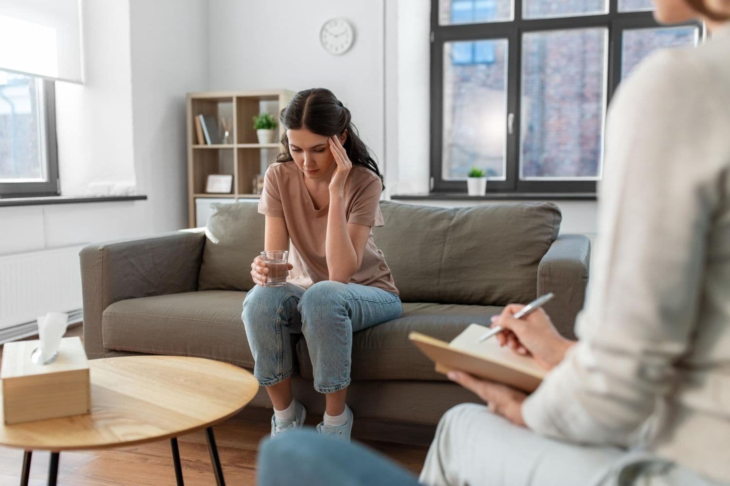 A person engaging in a therapy session to cope with ADHD.