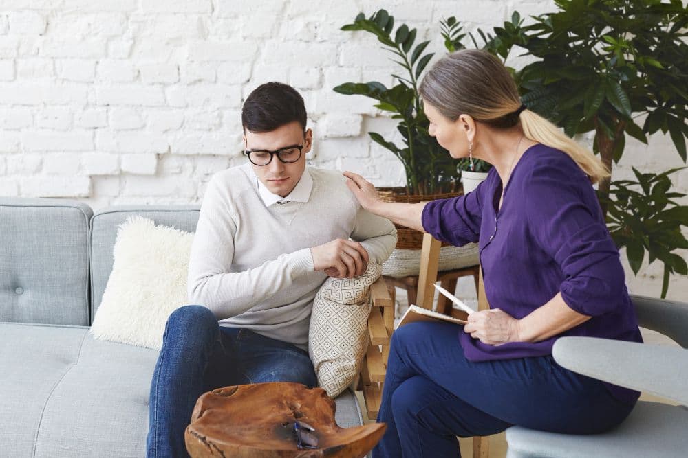 A person engaging in deep conversation during a therapy session. There is no single answer to how you should feel after therapy,