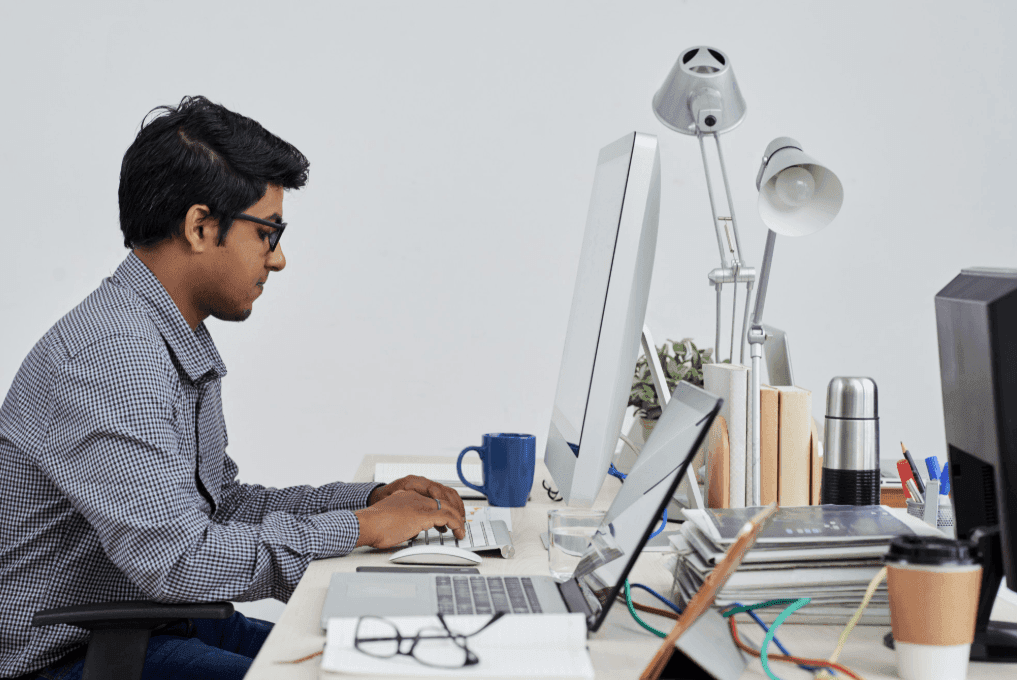 Employee working productively in the office after receiving support from EAP services.