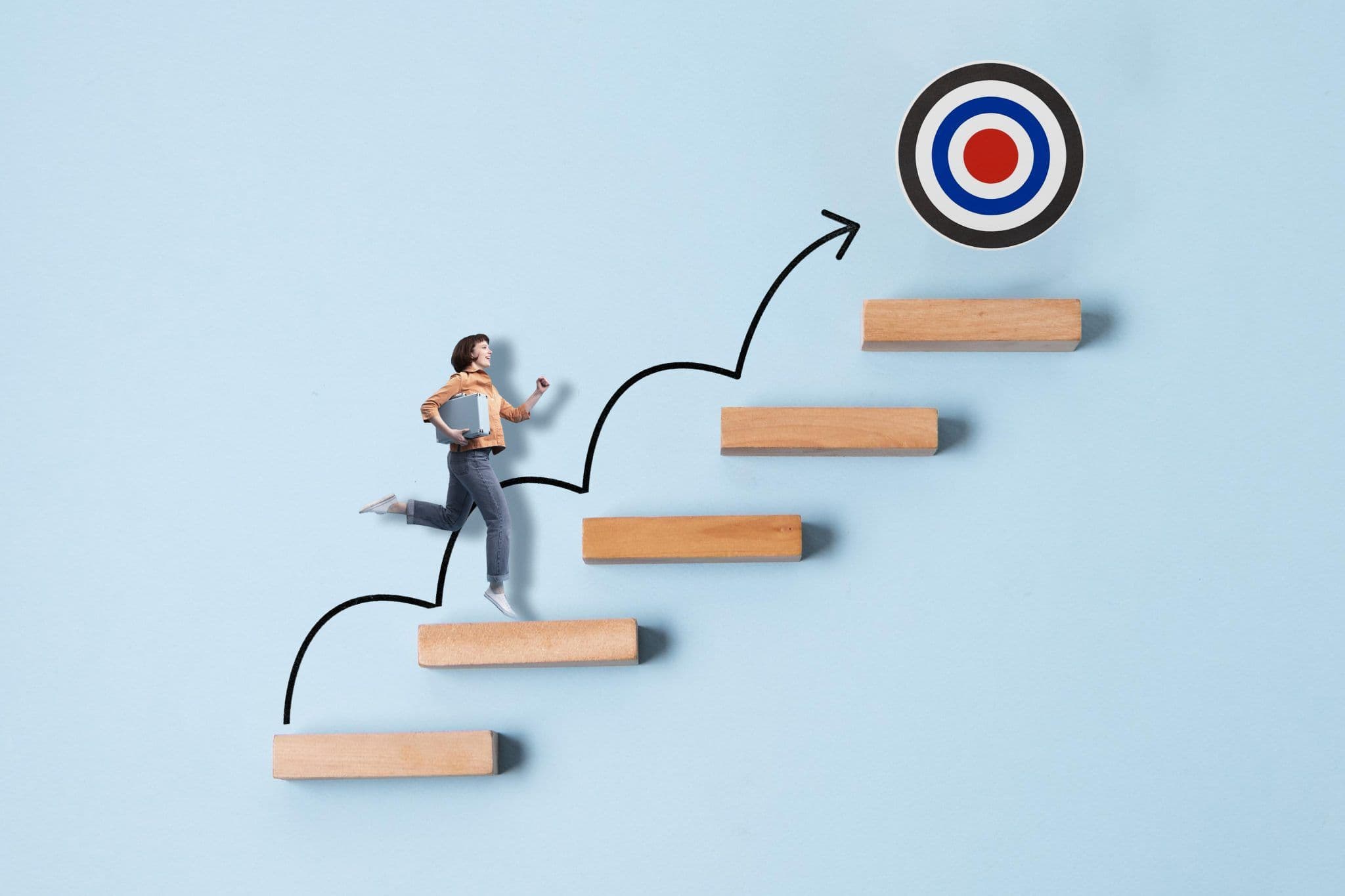 A person climbing metaphorical steps towards a goal sign, indicating personal development.