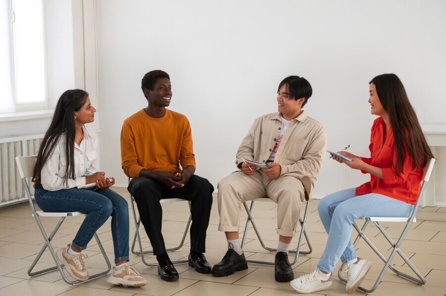 Four people in a support group to manage OCD symptoms.