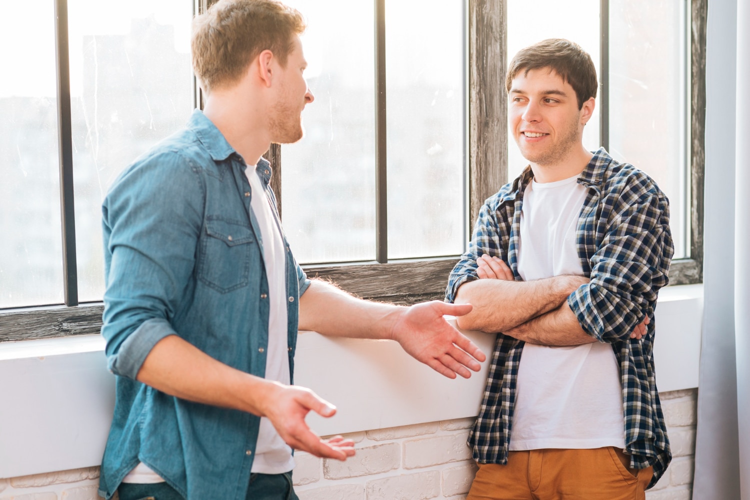 Two friends talking to each other about starting counselling in Australia.