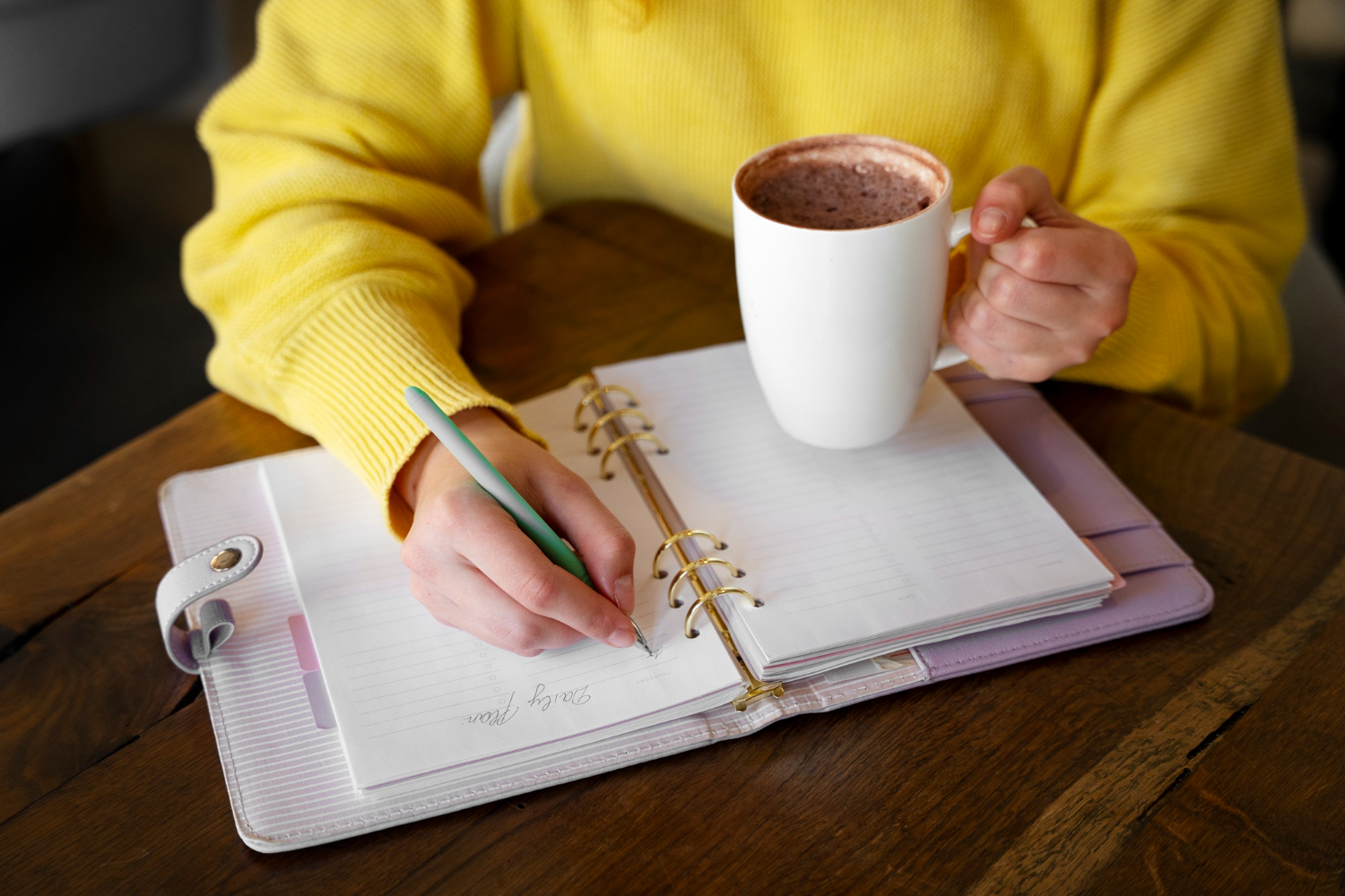 A person journalling to understand their therapy goals before talking to an affordable therapist.