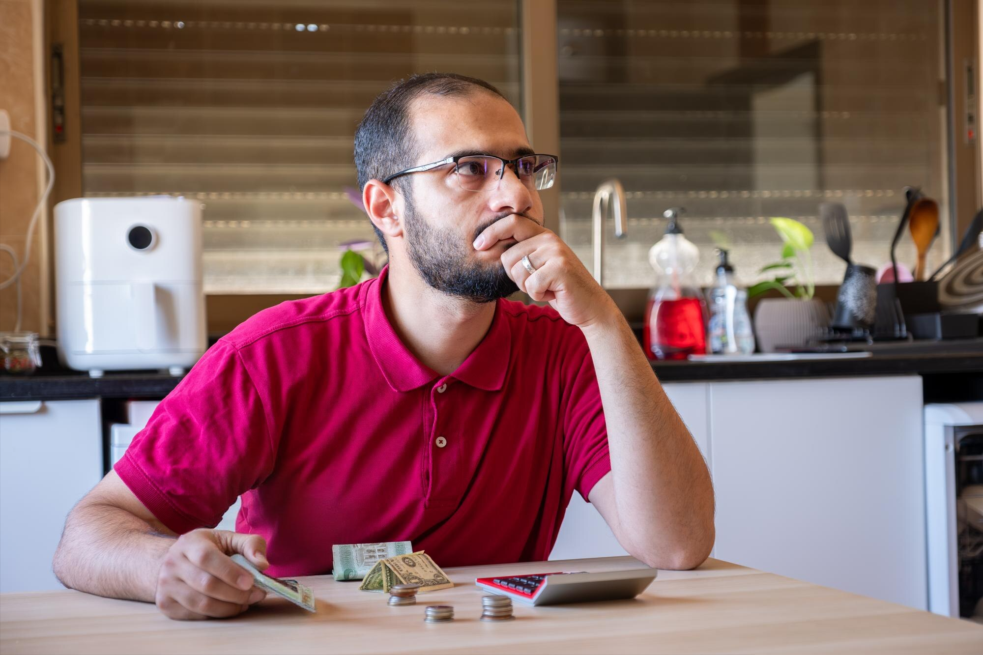 A person caculating finances to look for affordable therapists.