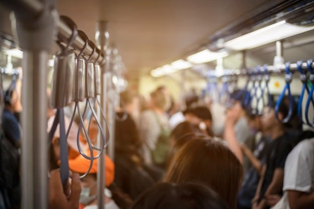 A blurry top view of a crowded train.