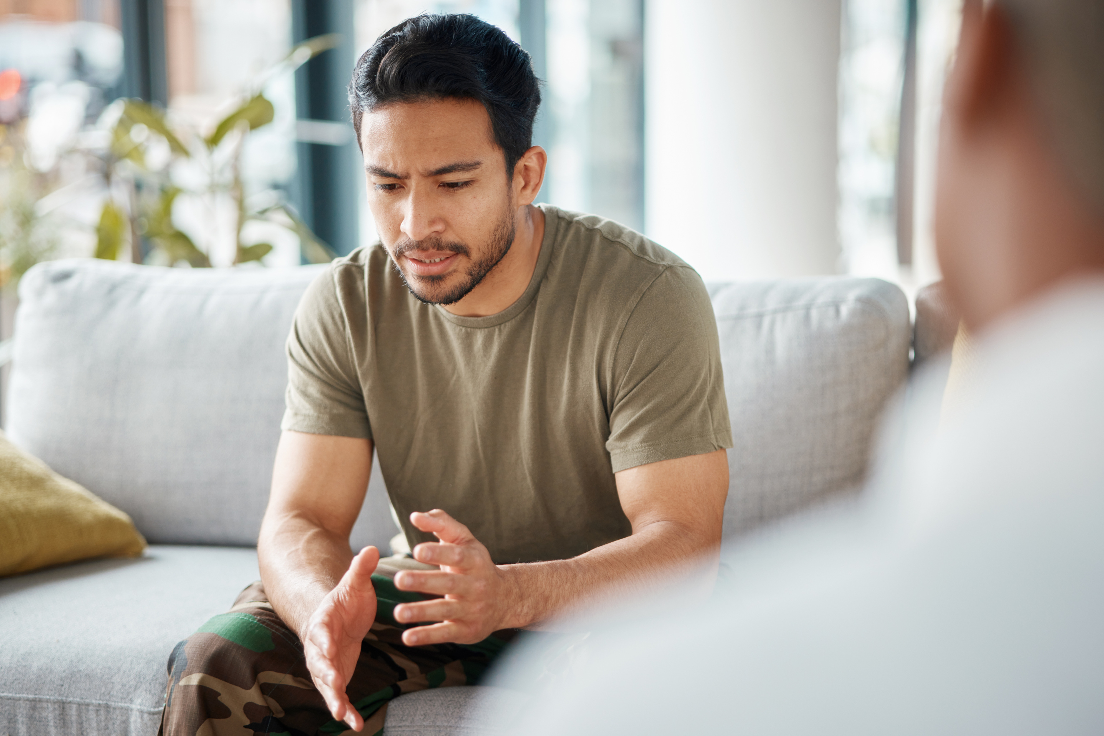 A man sharing his feelings during therapy.
