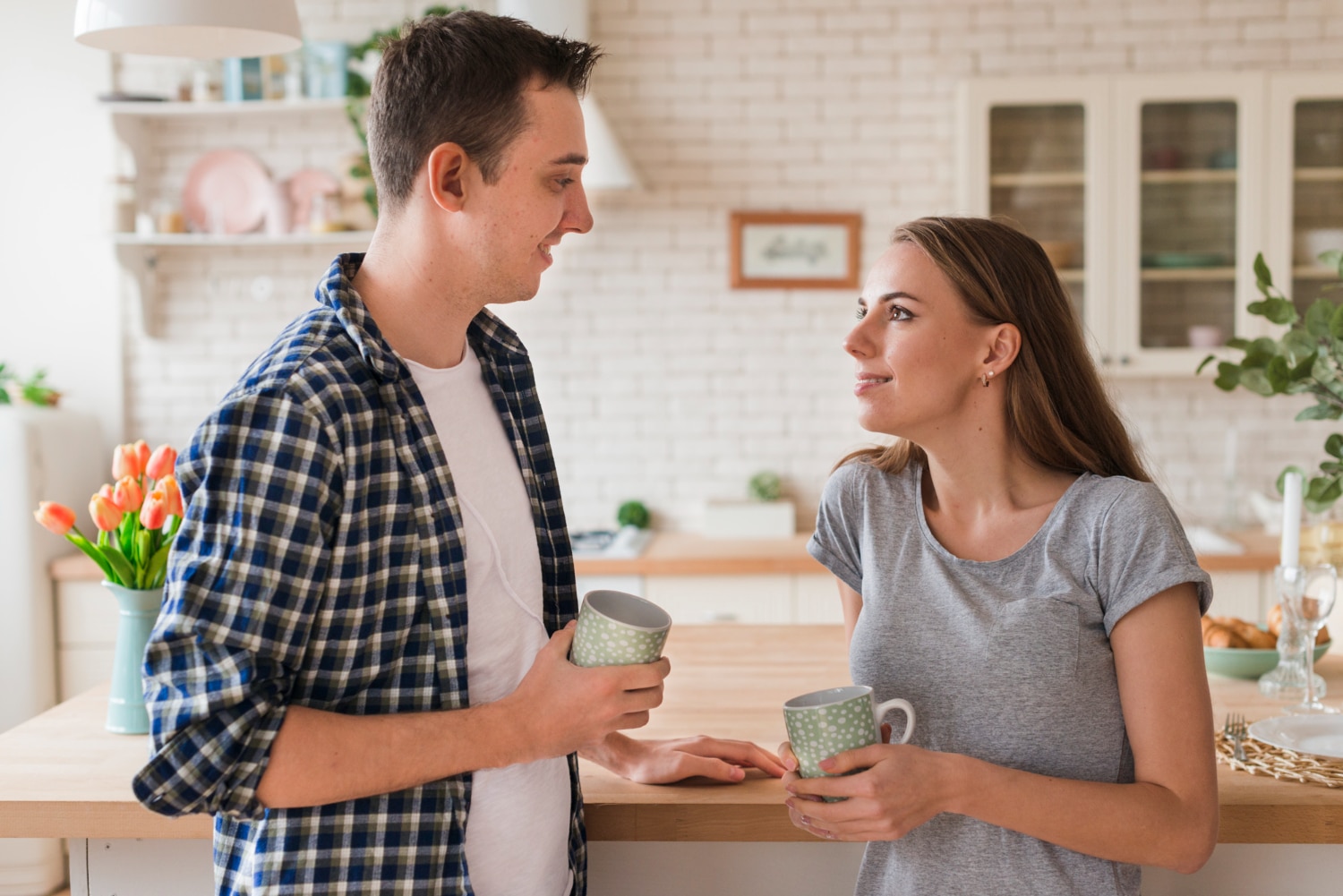 A couple talking to each other to explore areas they can address during couples therapy.